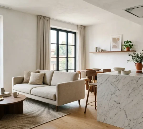 Vista panoramica di un open space moderno con cucina a isola e zona living integrata